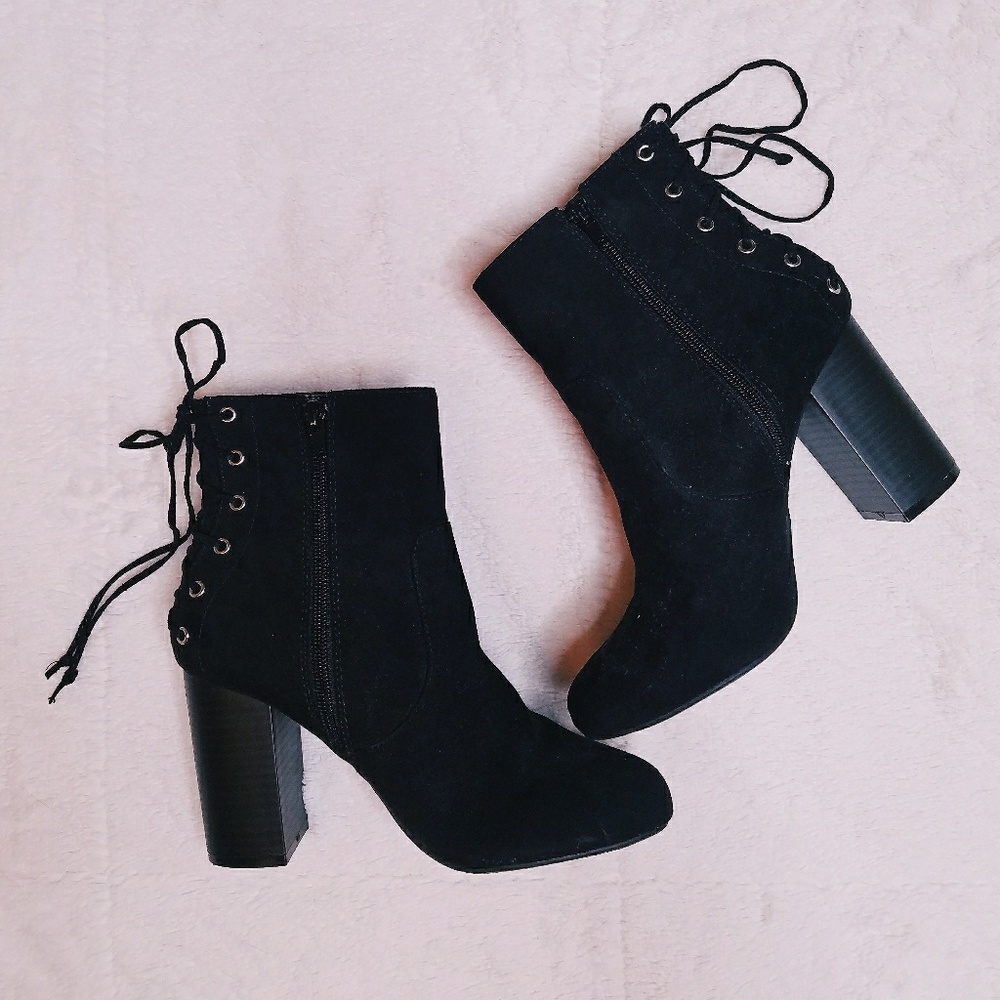 Black booties criss cross lacing in back of heel